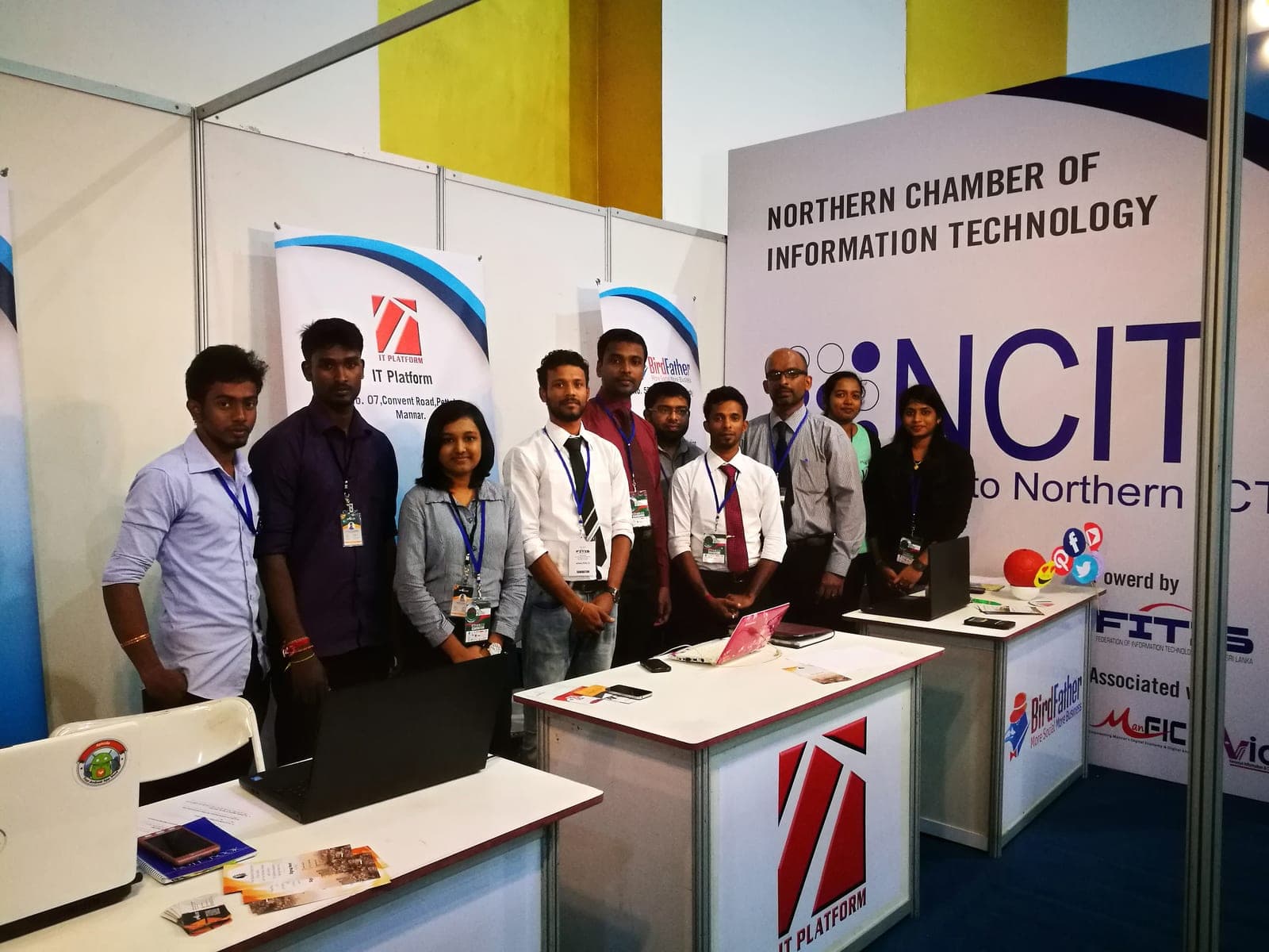 The Northern Chamber of Information Technology stand at the INFOTEL exhibition in 2017, with teams from member companies standing in front of the NCIT banner.
